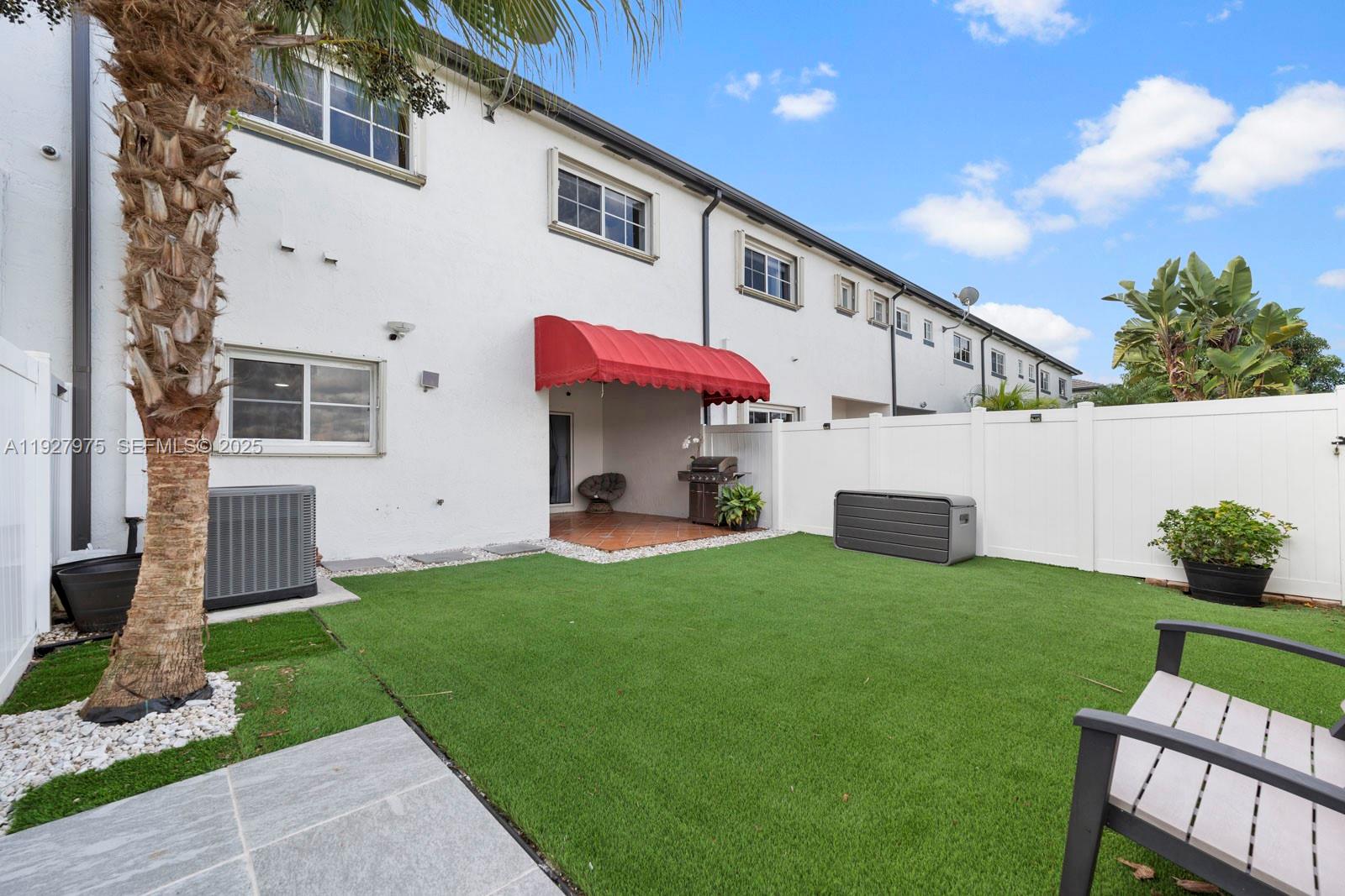 12881 Southwest 49th Court, Unit 12881 Miramar, FL 33027 - Photo 34 of 47 a view of a house with a yard and sitting area