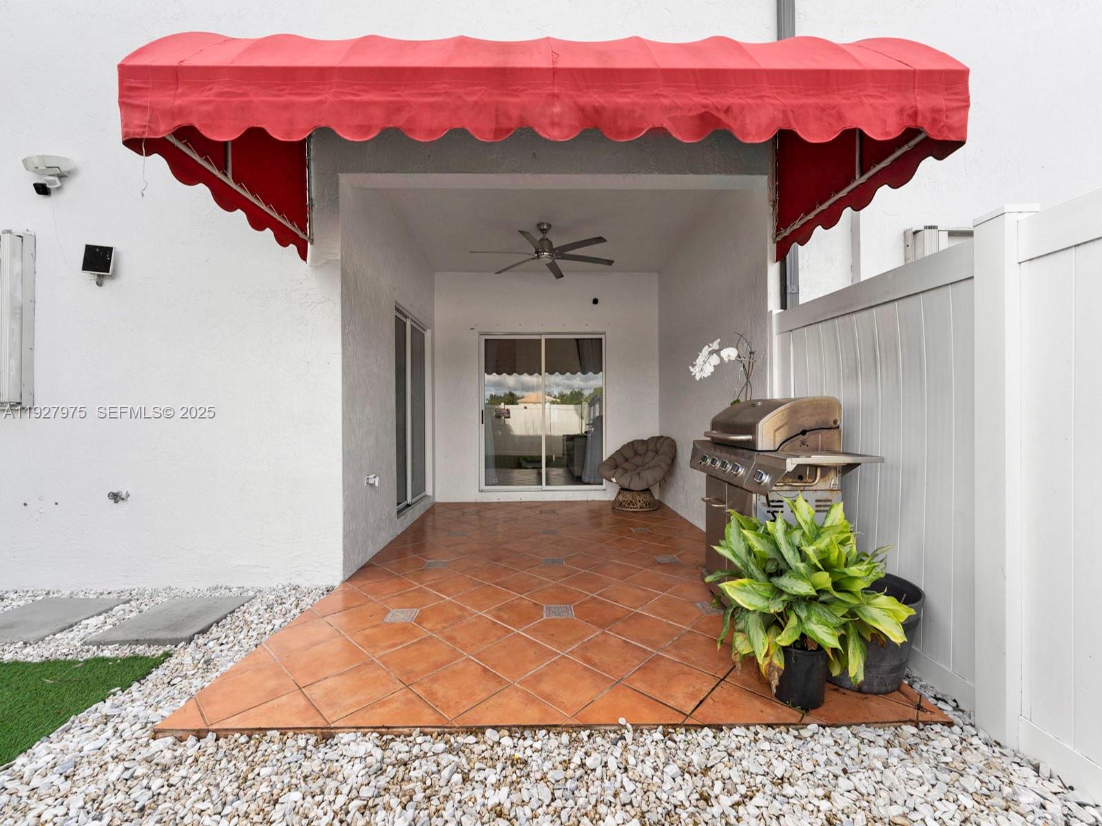 12881 Southwest 49th Court, Unit 12881 Miramar, FL 33027 - Photo 35 of 47 a vase of flowers sitting on a table