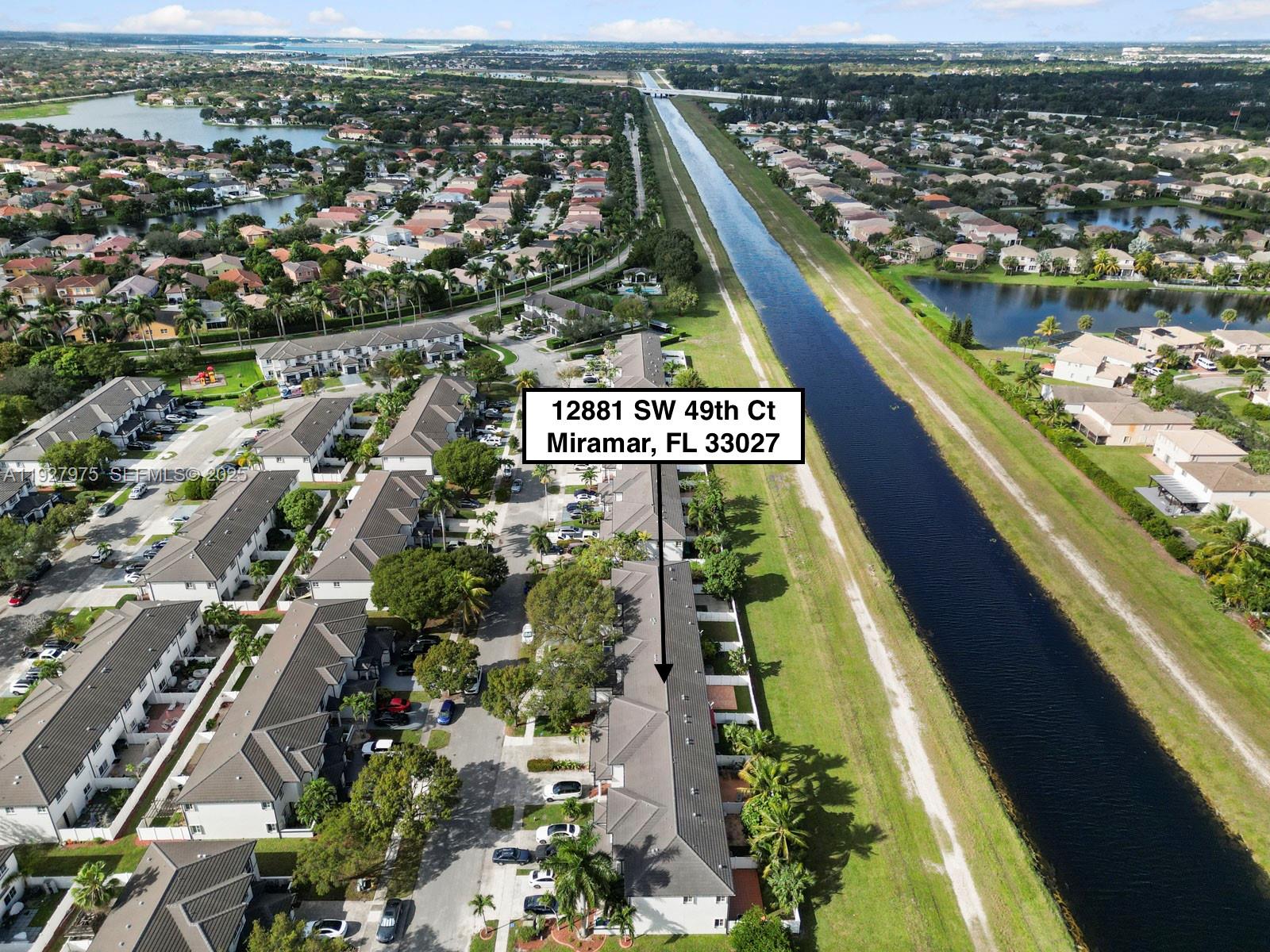 12881 Southwest 49th Court, Unit 12881 Miramar, FL 33027 - Photo 44 of 47 an aerial view of residential houses with outdoor space