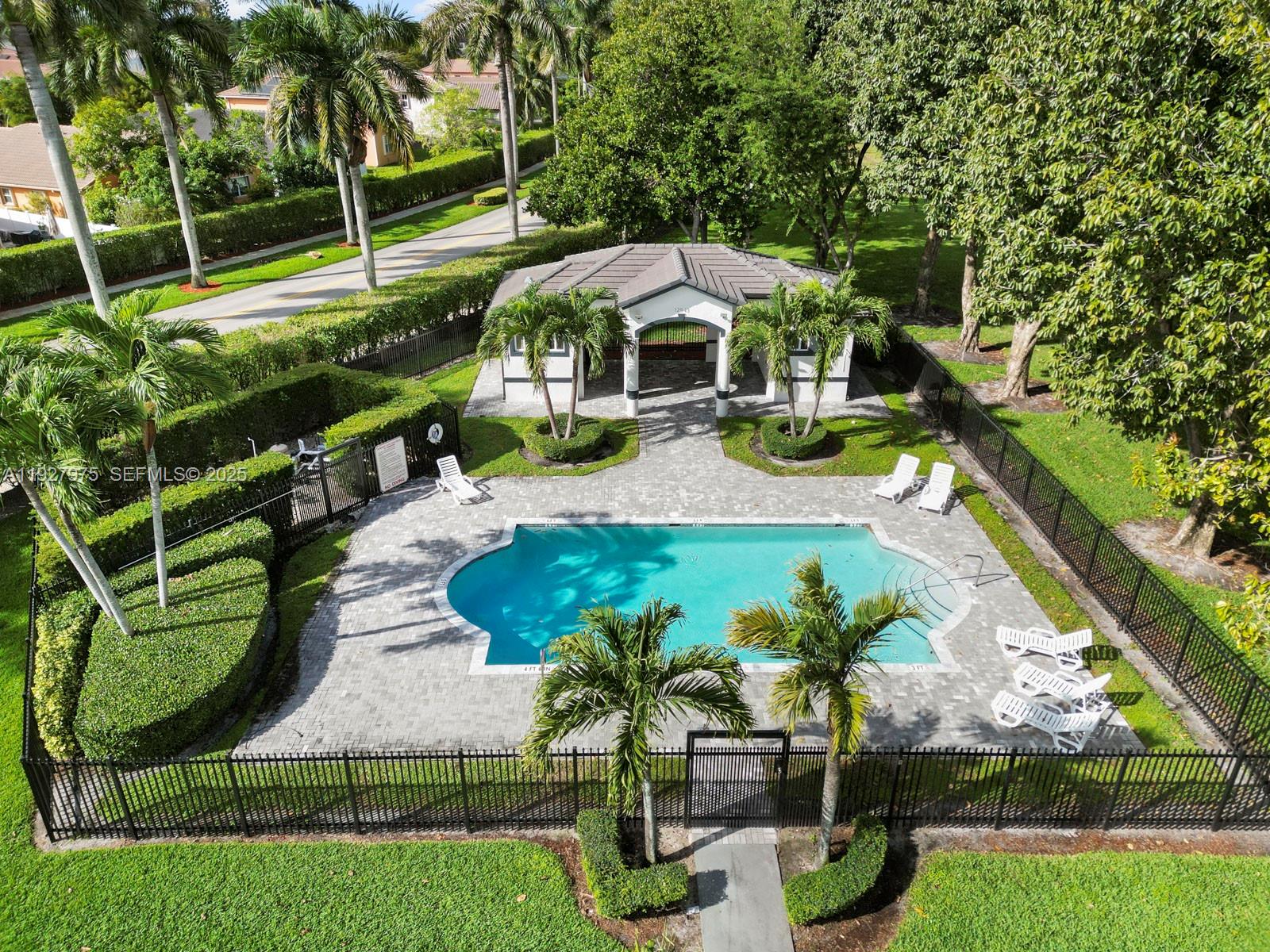 12881 Southwest 49th Court, Unit 12881 Miramar, FL 33027 - Photo 45 of 47 an aerial view of a house with swimming pool garden and patio