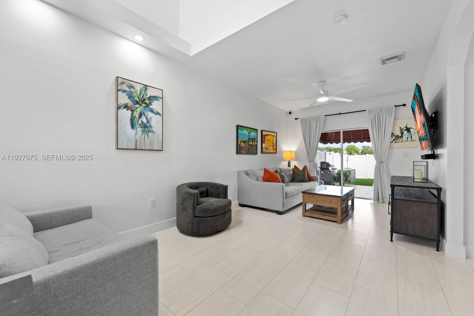 12881 Southwest 49th Court, Unit 12881 Miramar, FL 33027 - Photo 6 of 47 a living room with furniture