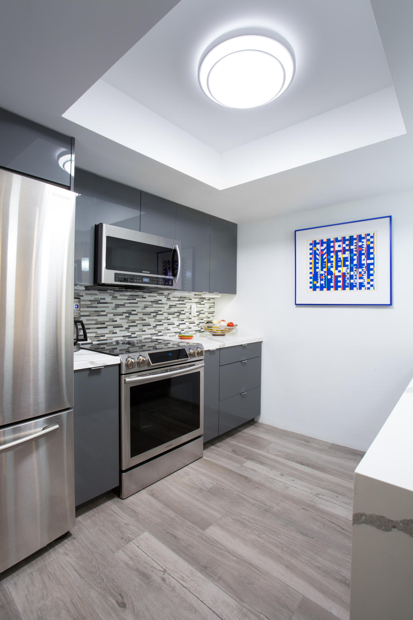 500 East Amado Road, Unit 111 Palm Springs, CA 92262 - Photo 20 of 48 a kitchen with stainless steel appliances kitchen island a refrigerator sink and stove