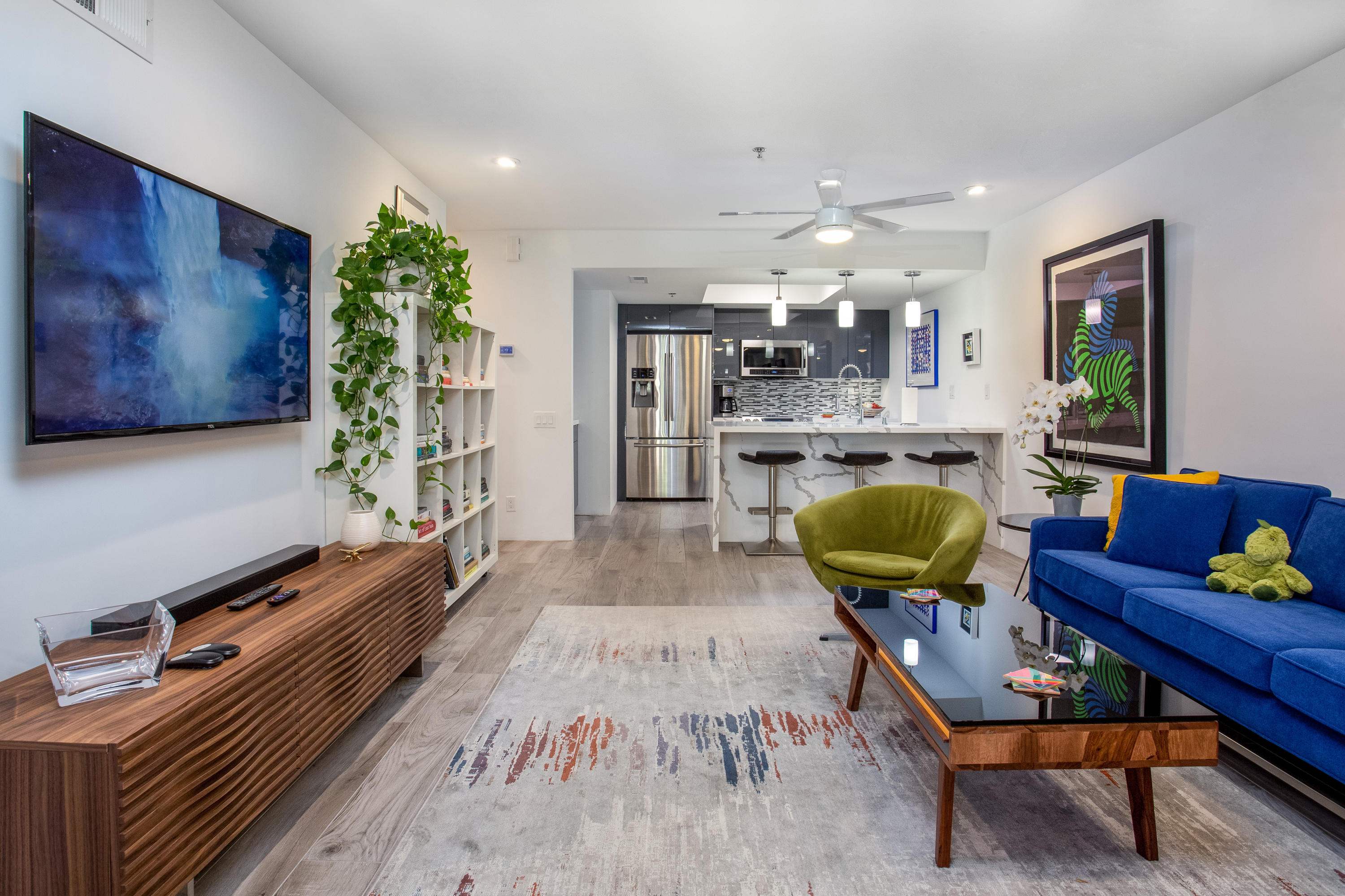 500 East Amado Road, Unit 111 Palm Springs, CA 92262 - Photo 3 of 48 a living room with furniture and wooden floor