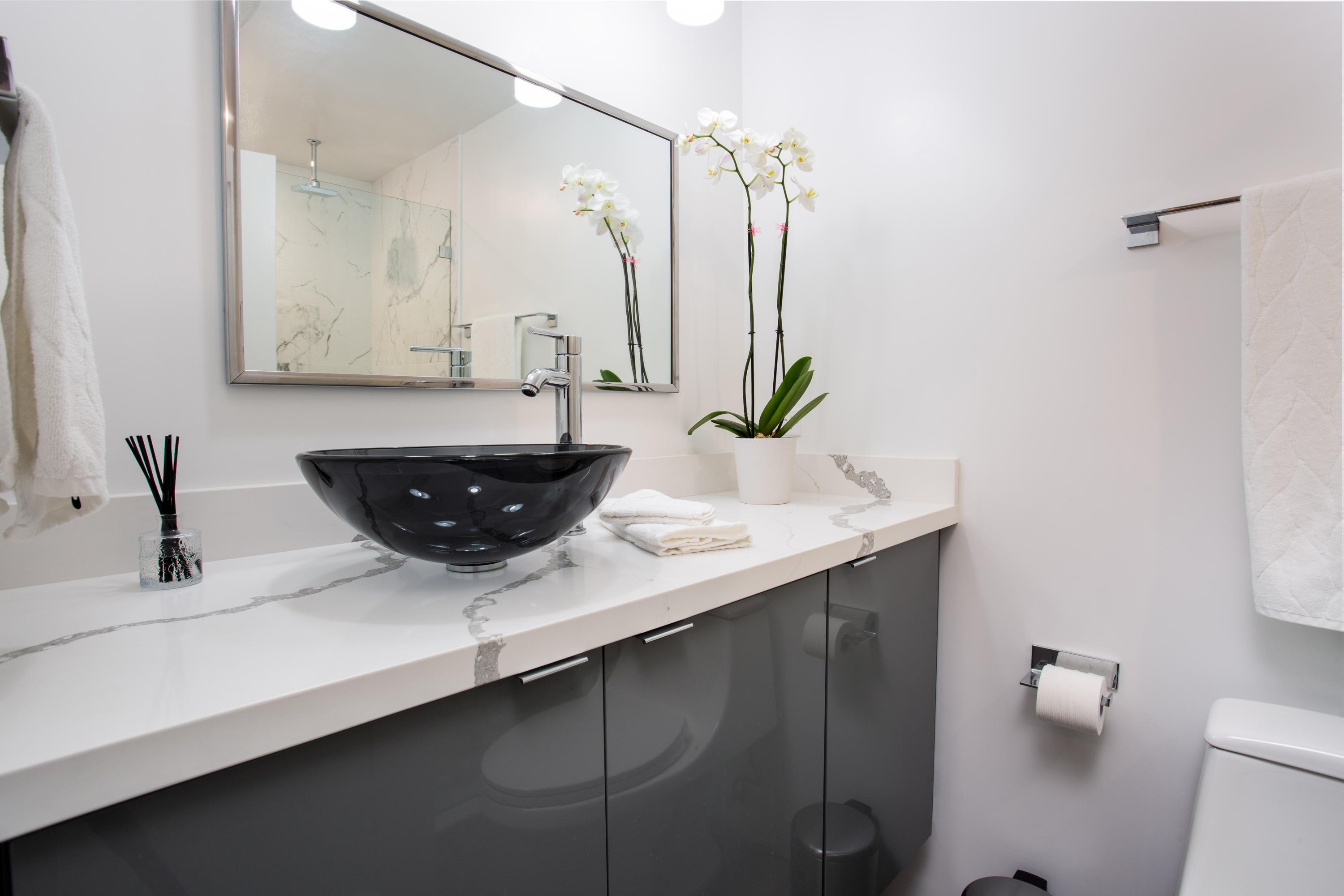 500 East Amado Road, Unit 111 Palm Springs, CA 92262 - Photo 23 of 48 a bathroom with a sink and a mirror
