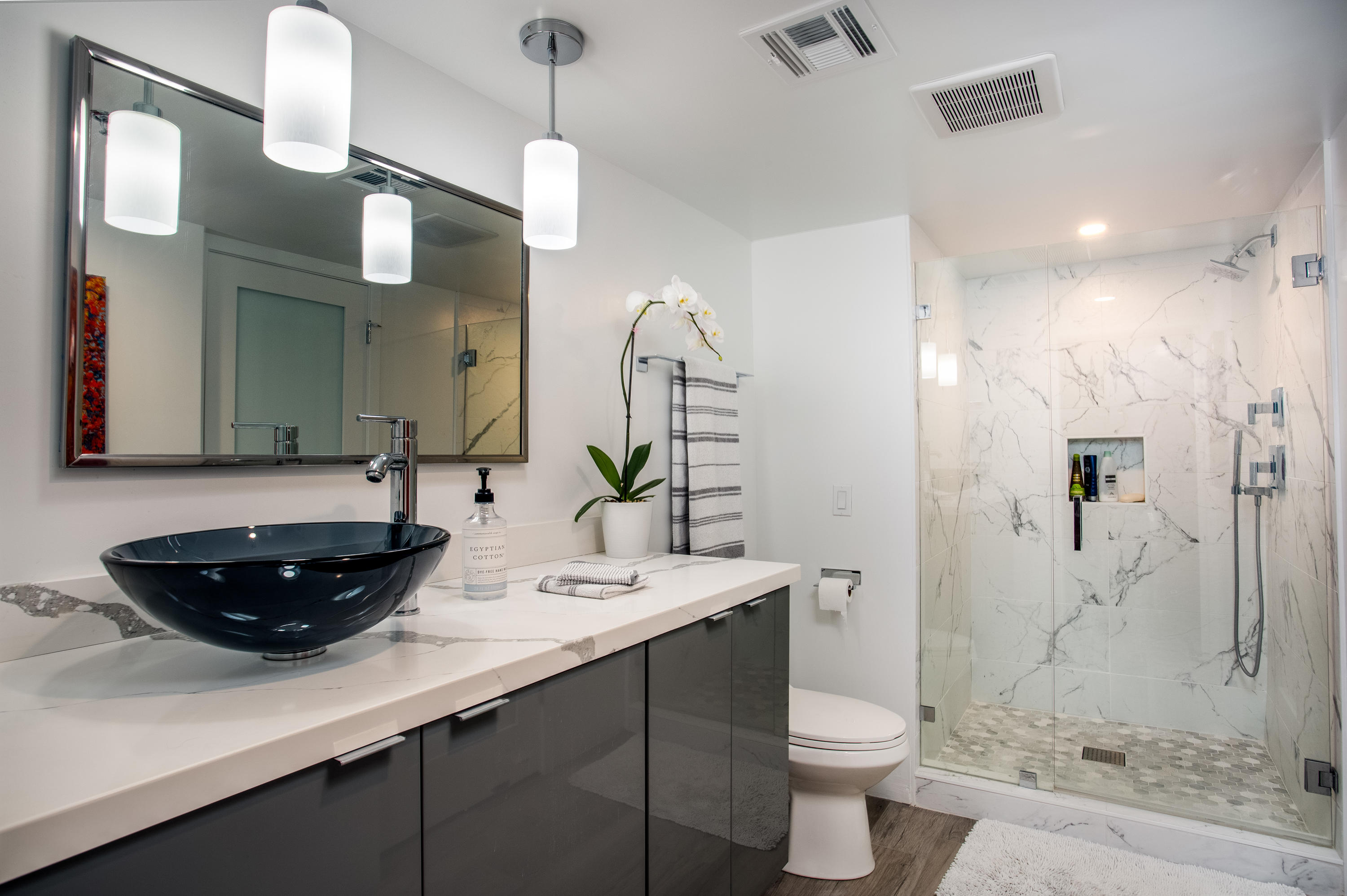 500 East Amado Road, Unit 111 Palm Springs, CA 92262 - Photo 30 of 48 a bathroom with a sink a toilet and shower