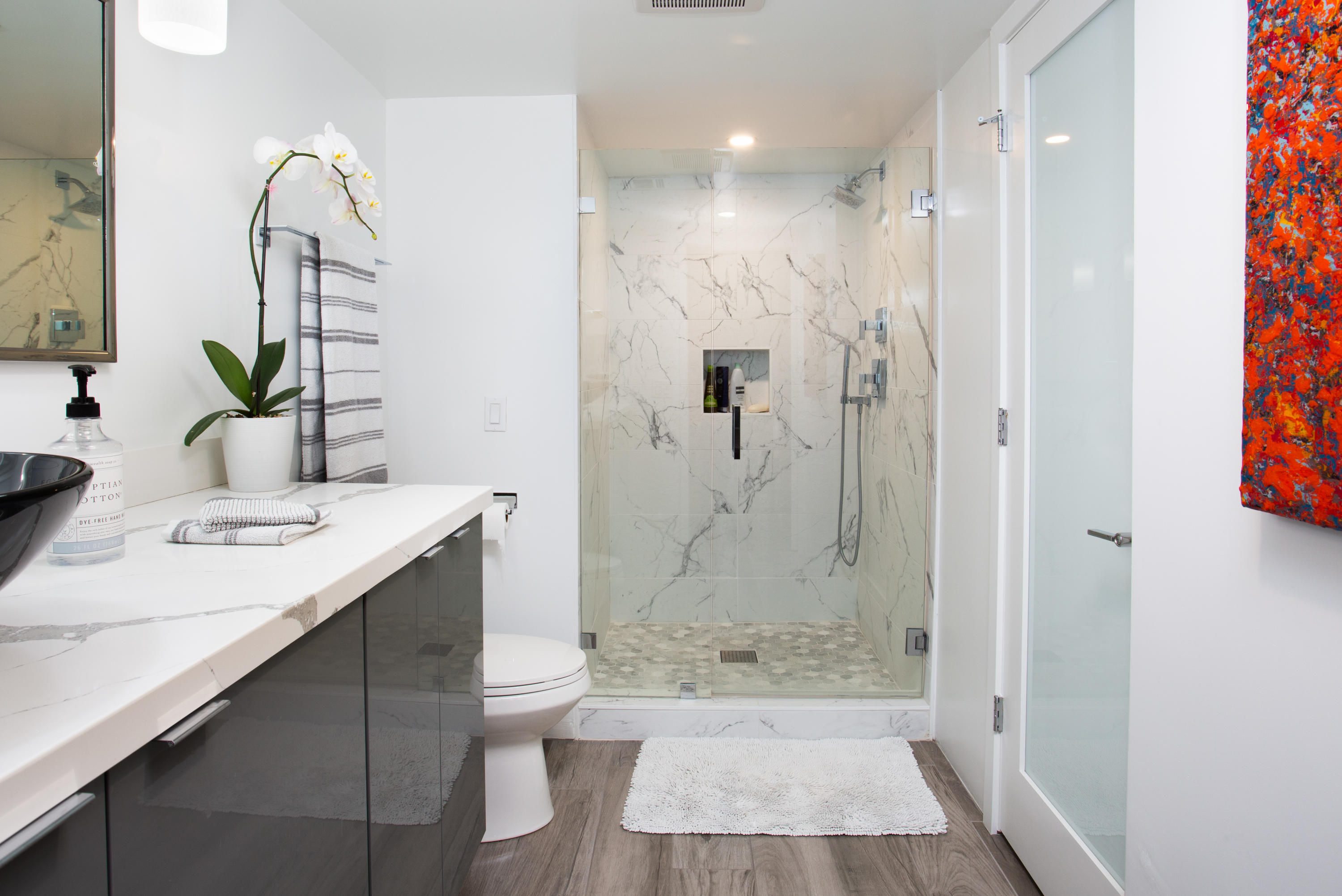 500 East Amado Road, Unit 111 Palm Springs, CA 92262 - Photo 31 of 48 a bathroom with a sink and a mirror