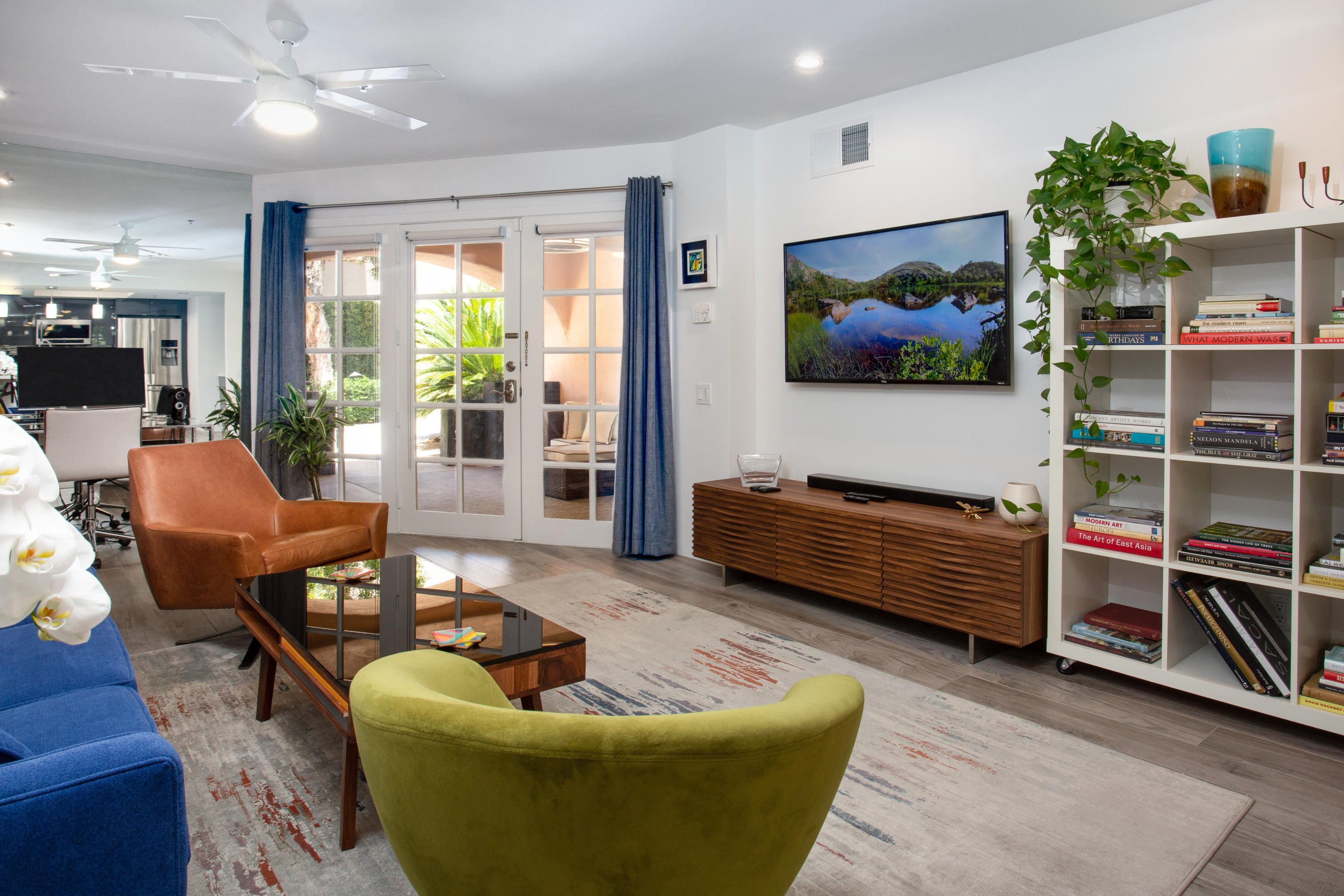 500 East Amado Road, Unit 111 Palm Springs, CA 92262 - Photo 5 of 48 a living room with furniture and a flat screen tv