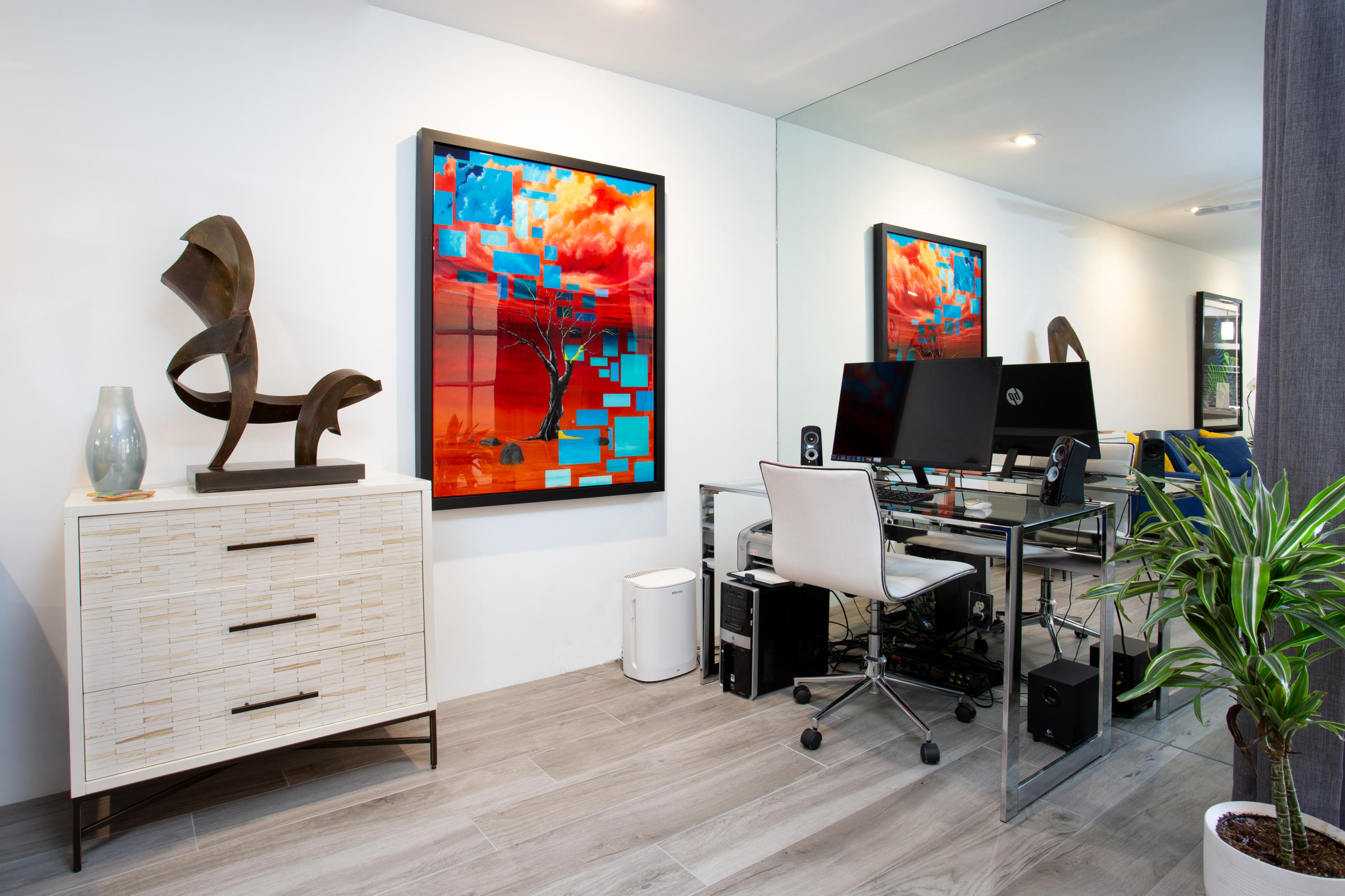 500 East Amado Road, Unit 111 Palm Springs, CA 92262 - Photo 10 of 48 a view of a workspace with furniture and a flat screen tv