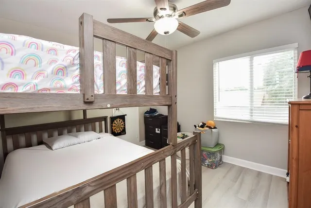 a bedroom with a bed and a television