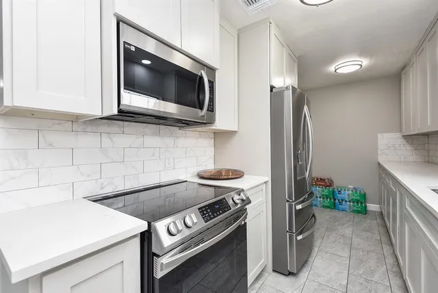 a kitchen with a stove and a microwave