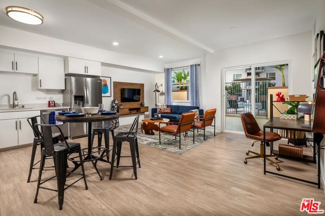 10568 Promenade Gateway, Unit 204 El Monte, CA 91731 - Photo 22 of 34 a view of a dining room with furniture and wooden floor