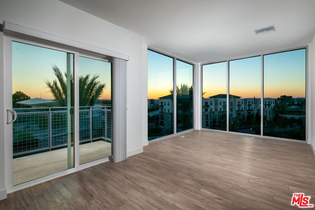 10568 Promenade Gateway, Unit 204 El Monte, CA 91731 - Photo 34 of 34 a view of an empty room with glass door and a window