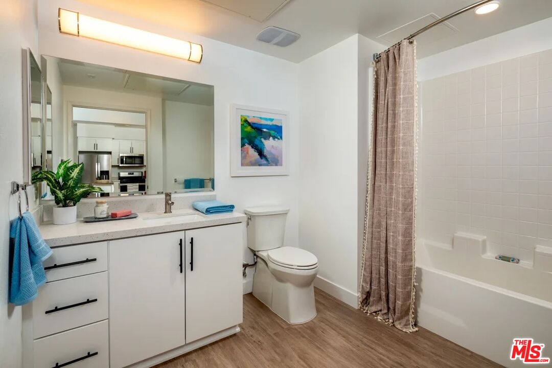 10568 Promenade Gateway, Unit 204 El Monte, CA 91731 - Photo 6 of 34 a bathroom with a sink a toilet and shower