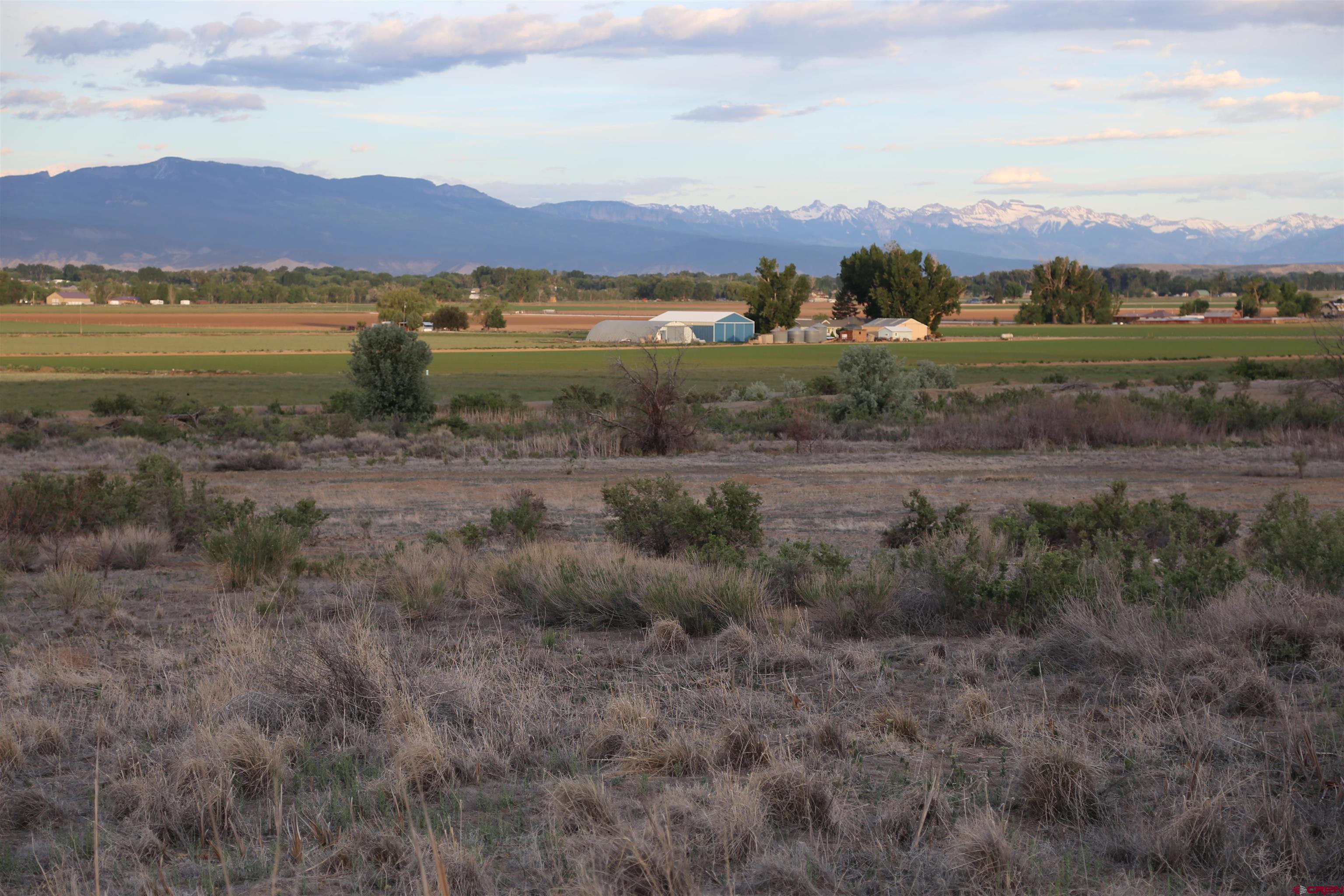 Tdb 5950th Road Montrose, CO 81403 - Photo 3 of 12 a view of a lake with a mountain