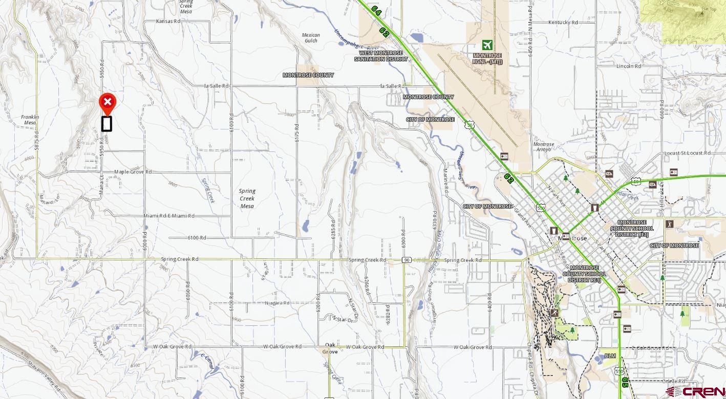 Tdb 5950th Road Montrose, CO 81403 - Photo 10 of 12 a white building with glass door