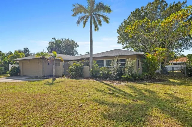 a house with swimming pool in front of it
