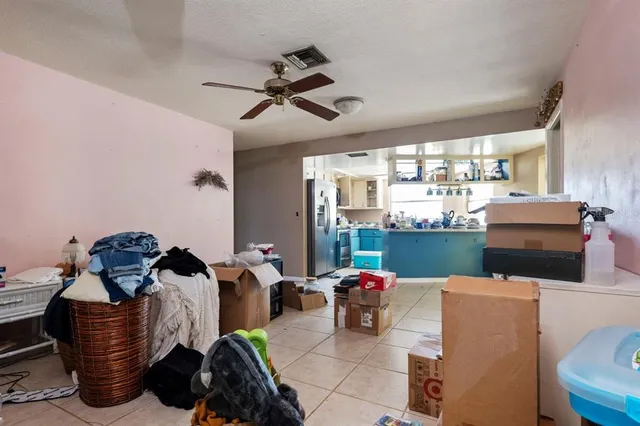 a kitchen with lots of counter top space and furniture