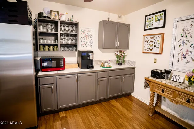 a kitchen with a sink cabinets and window