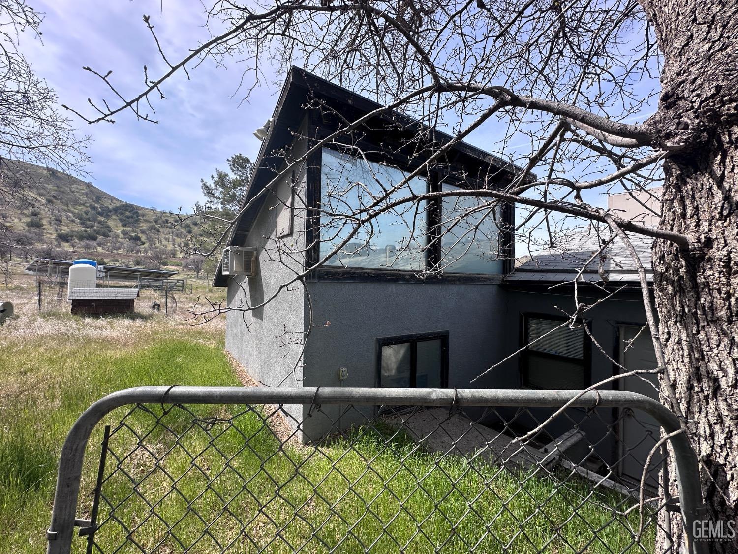 Undisclosed Address Bodfish, CA 93205 - Photo 22 of 61 The loft is from the outside with the entrance below on the right.