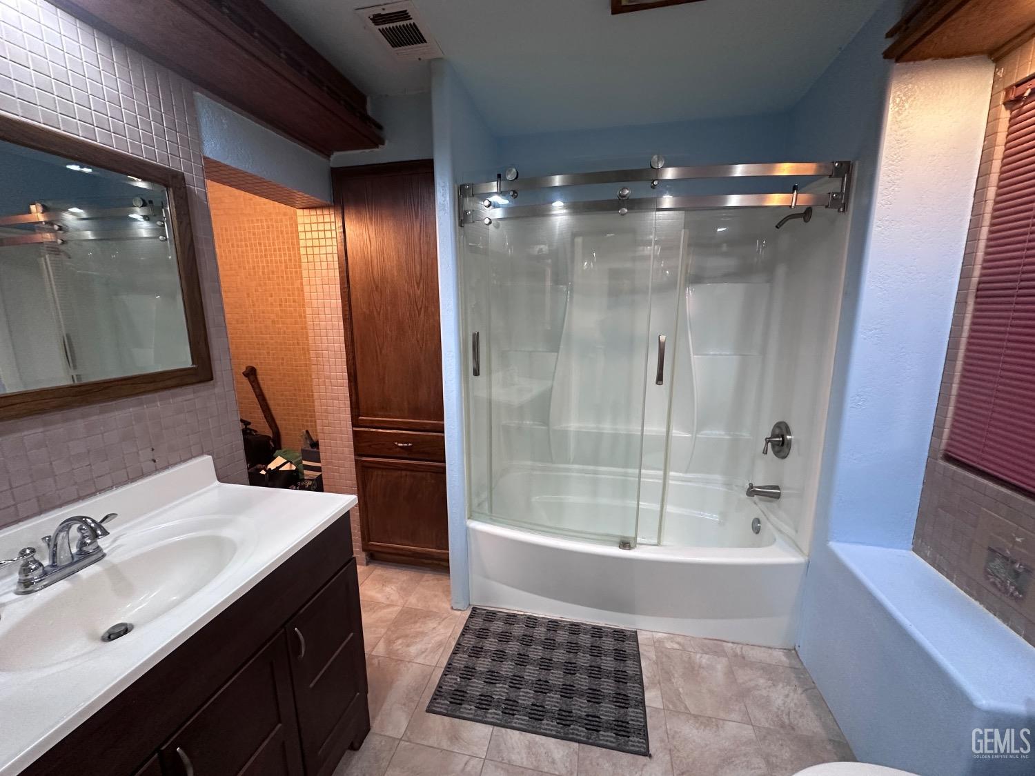 Undisclosed Address Bodfish, CA 93205 - Photo 7 of 61 Nice bathroom with a cosmetic space on the left, which leads into the main bedroom.