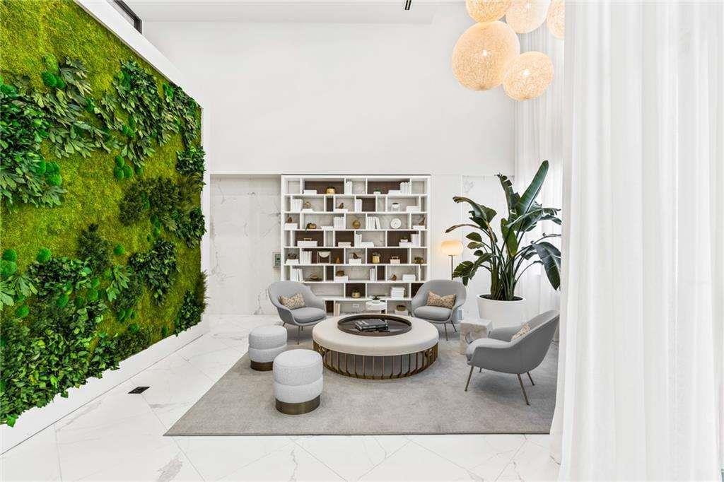 775 Juniper Street Northeast, Unit 111 Atlanta, GA 30308 - Photo 17 of 56 a table with chairs and potted plant