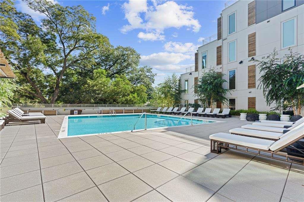 775 Juniper Street Northeast, Unit 111 Atlanta, GA 30308 - Photo 29 of 56 a view of house with swimming pool outdoor seating