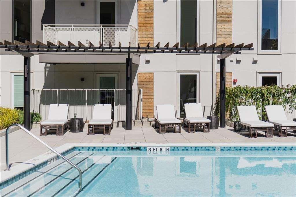 775 Juniper Street Northeast, Unit 111 Atlanta, GA 30308 - Photo 33 of 56 a view of a balcony with sitting area