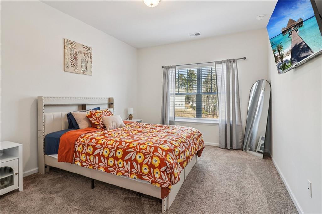 3625 Fairhaven Drive Powder Springs, GA 30127 - Photo 11 of 20 a bedroom with a bed lamp and a window