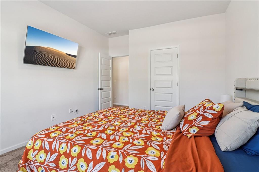 3625 Fairhaven Drive Powder Springs, GA 30127 - Photo 12 of 20 a bedroom with a bed and a flat screen tv
