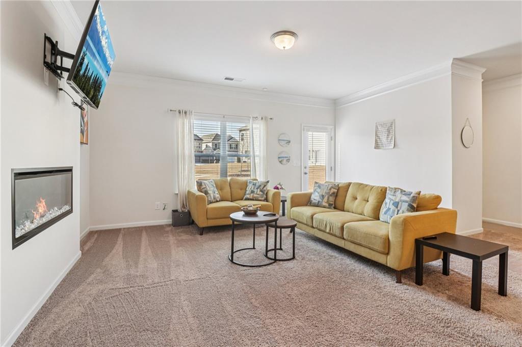 3625 Fairhaven Drive Powder Springs, GA 30127 - Photo 2 of 20 a living room with furniture a fireplace and a window