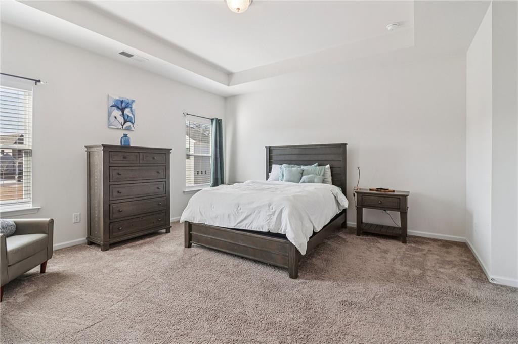 3625 Fairhaven Drive Powder Springs, GA 30127 - Photo 8 of 20 a bedroom with a bed and a dresser