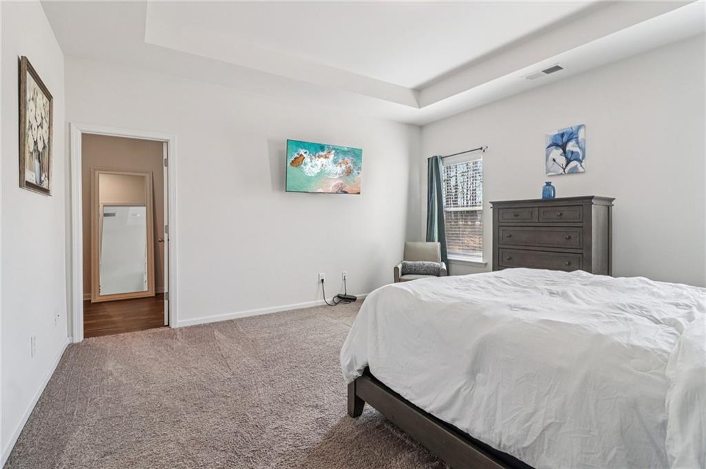 3625 Fairhaven Drive Powder Springs, GA 30127 - Photo 9 of 20 a bedroom with a bed and a dresser