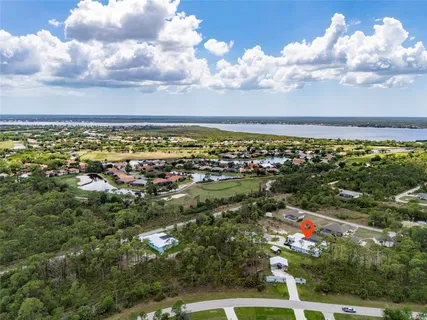 a living room with furniture and a ceiling fan