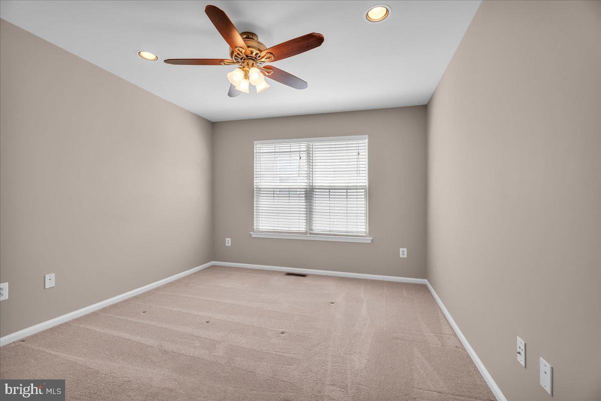 68 Hillside Lane Mount Laurel, NJ 08054 - Photo 21 of 36 an empty room with a window and a fan