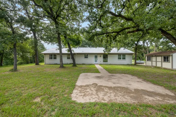 a view of house with a garden