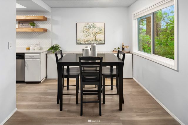a view of a dining room with furniture window and outside view