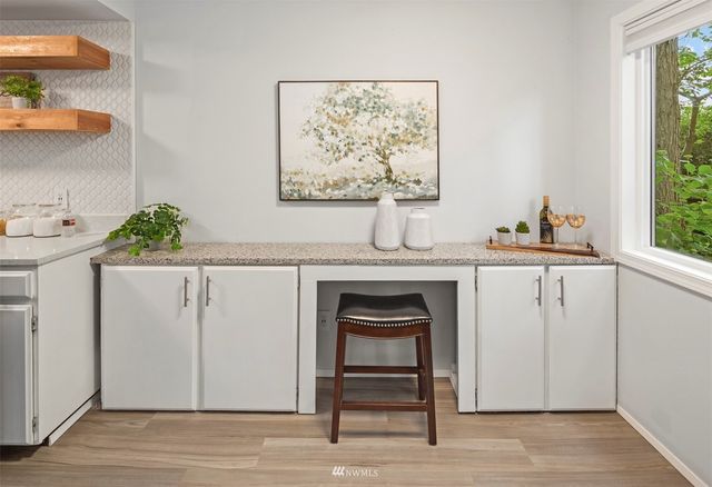 a view of cabinets a sink and a window