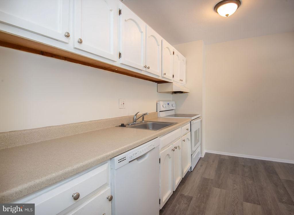 76 Welsh Tract Road, Unit F306 Newark, DE 19713 - Photo 4 of 18 a room with a sink cabinets and utility