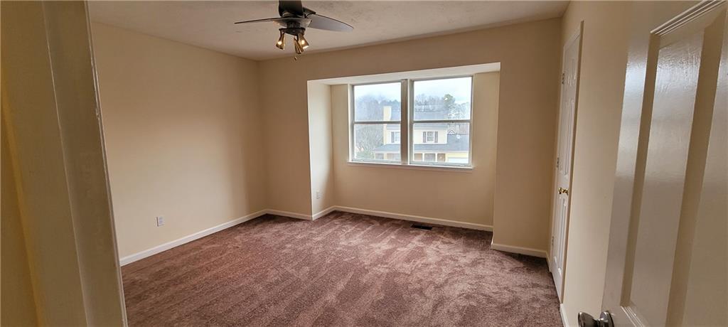 2082 Montgomery Trail Duluth, GA 30096 - Photo 22 of 31 an empty room with windows and closet