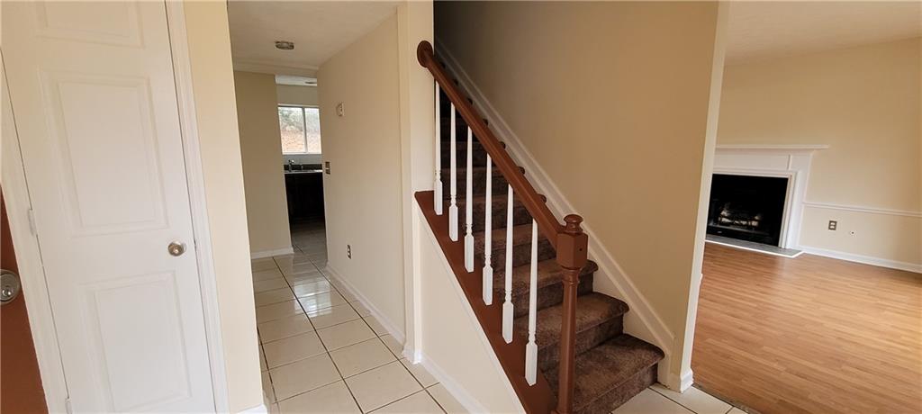 2082 Montgomery Trail Duluth, GA 30096 - Photo 3 of 31 a view of a hallway with wooden floor and staircase