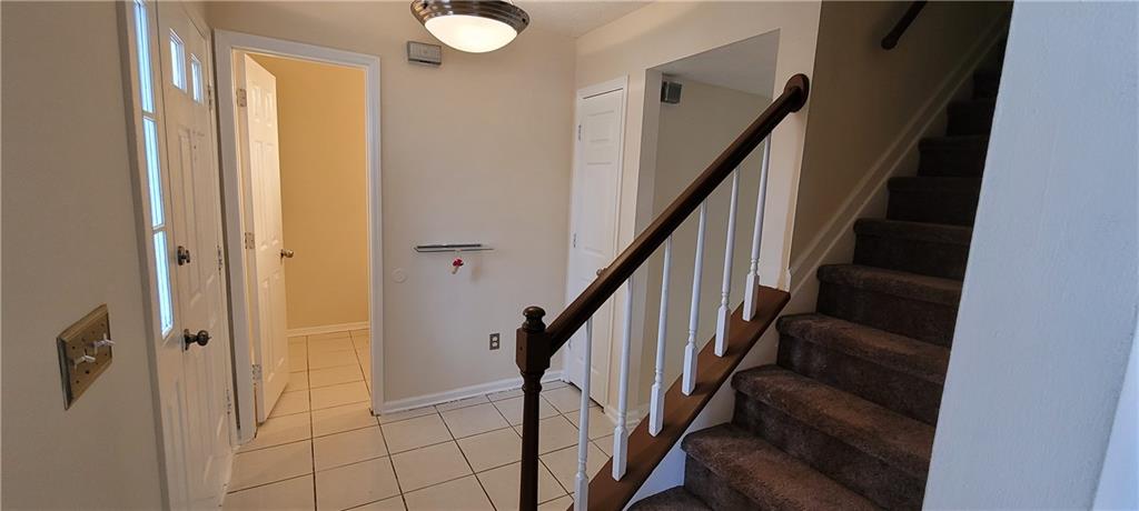 2082 Montgomery Trail Duluth, GA 30096 - Photo 4 of 31 a view of staircase with wooden floor and staircase