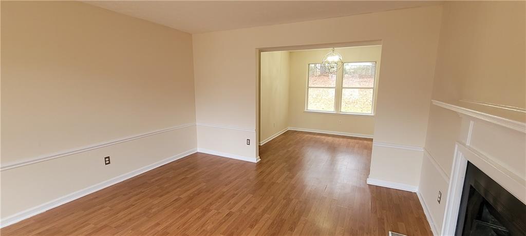 2082 Montgomery Trail Duluth, GA 30096 - Photo 8 of 31 an empty room with wooden floor and windows