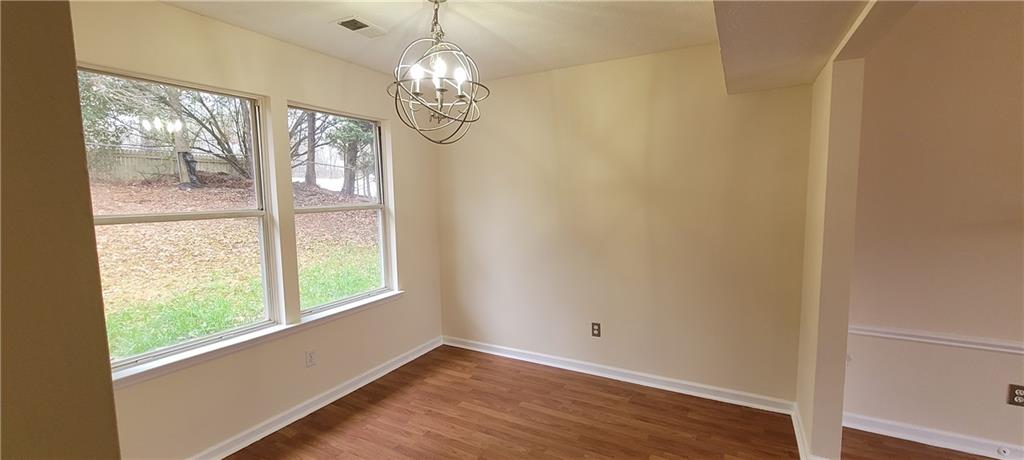 2082 Montgomery Trail Duluth, GA 30096 - Photo 10 of 31 a view of empty room with wooden floor and fan
