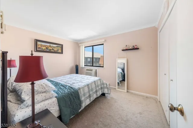 a bedroom with a bed and dresser