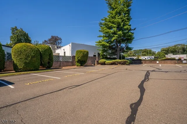 a view of a street with a building in the background
