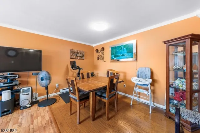 a view of a livingroom with furniture and a flat screen tv