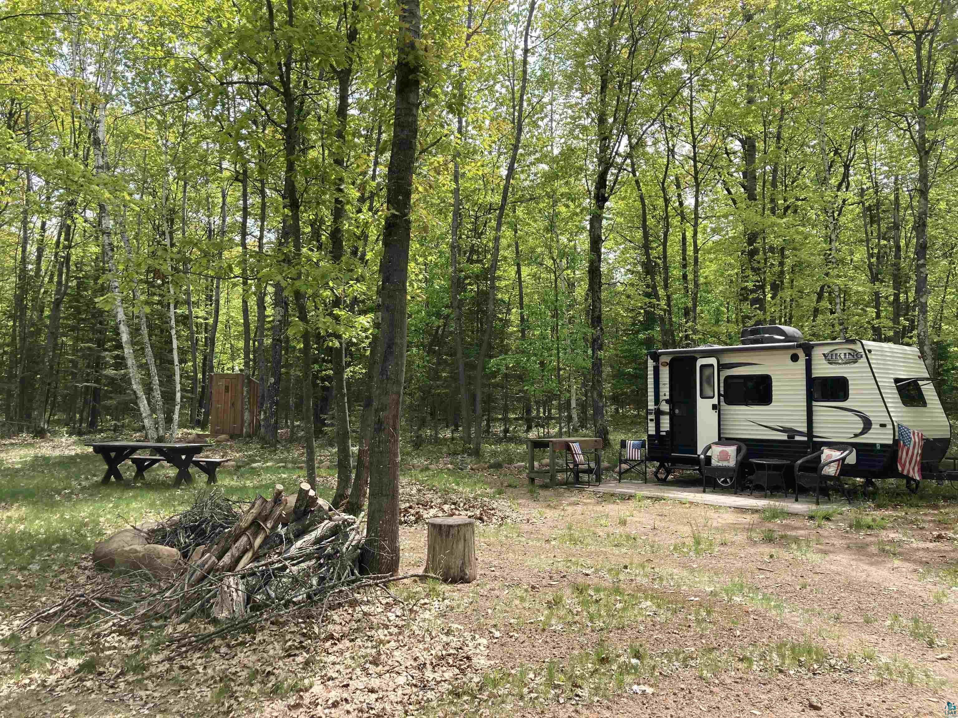 14334 East Eagle Ridge Brule, WI 54820 - Photo 5 of 26 View of yard with a view of trees
