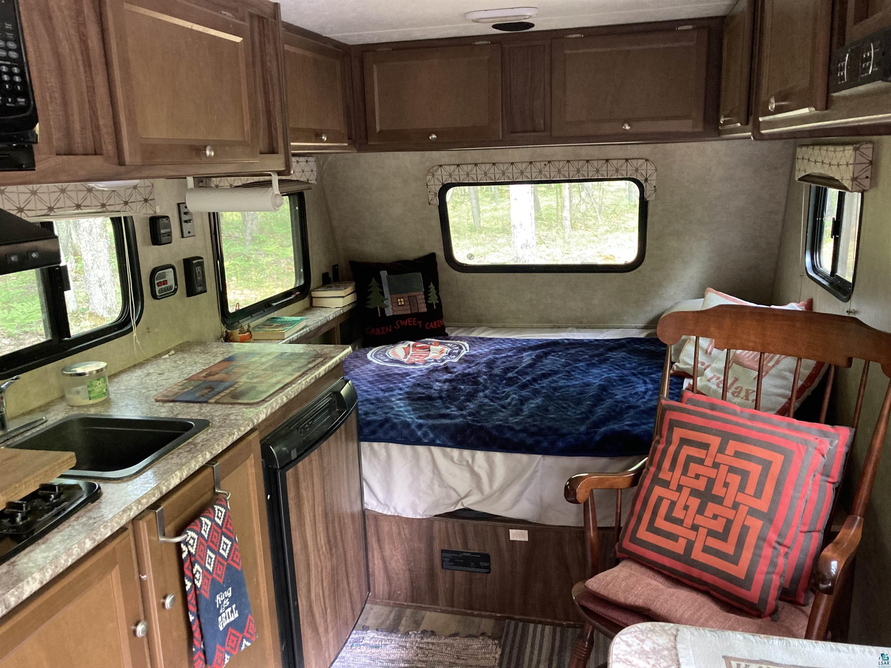14334 East Eagle Ridge Brule, WI 54820 - Photo 6 of 26 Kitchen with dishwashing machine, light countertops, and black gas cooktop