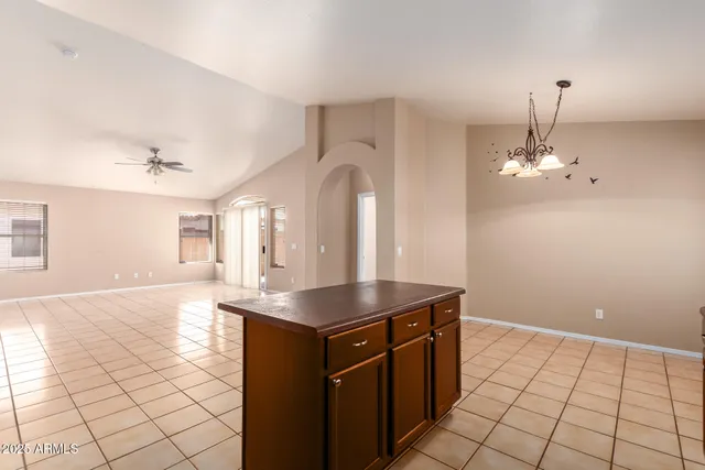 a kitchen with a sink a counter top space and cabinets