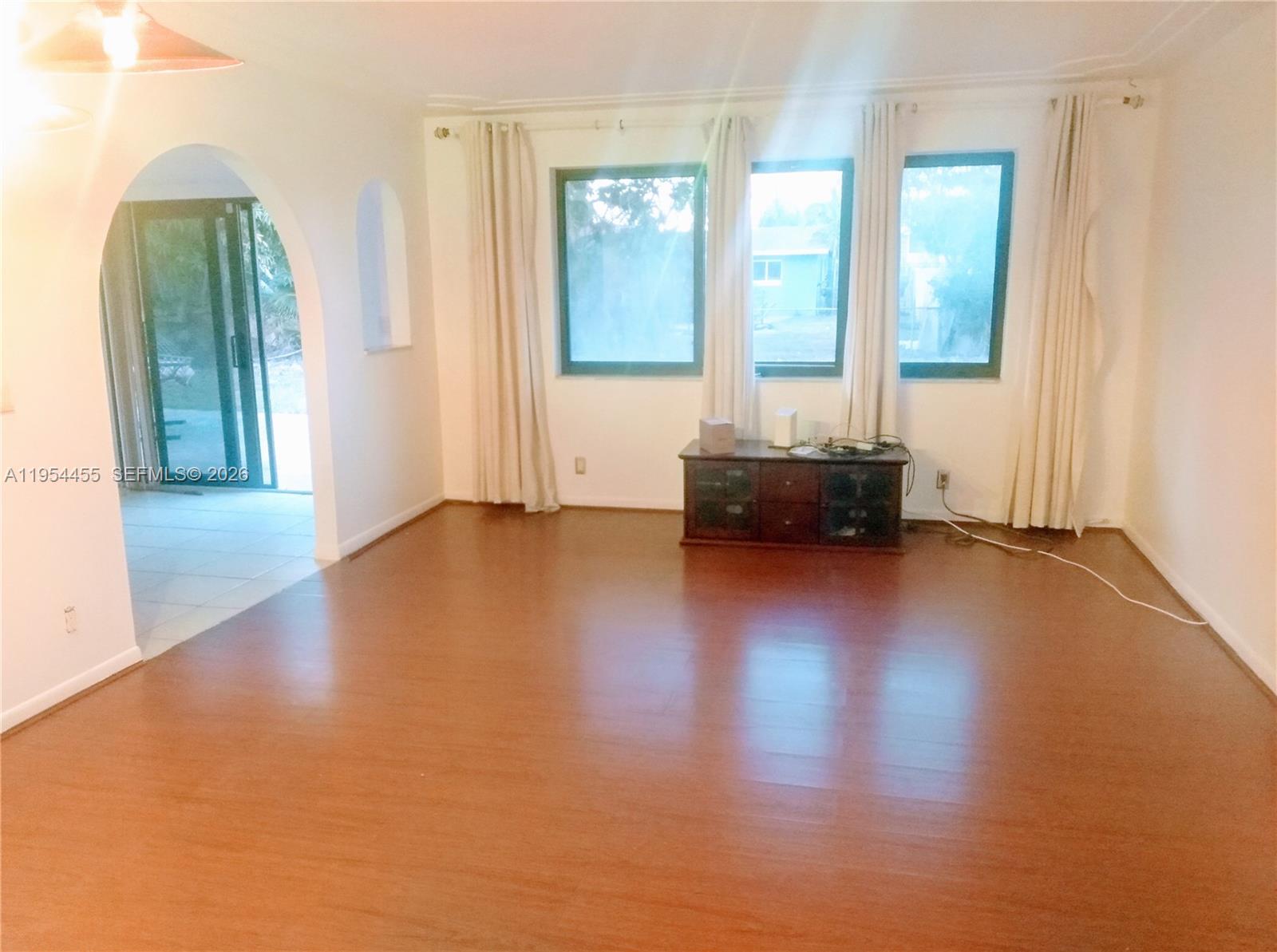 4411 Northwest 15th Street Lauderhill, FL 33313 - Photo 3 of 14 a living room with furniture and a large window